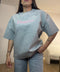 T-shirt LUMINA over con scritta